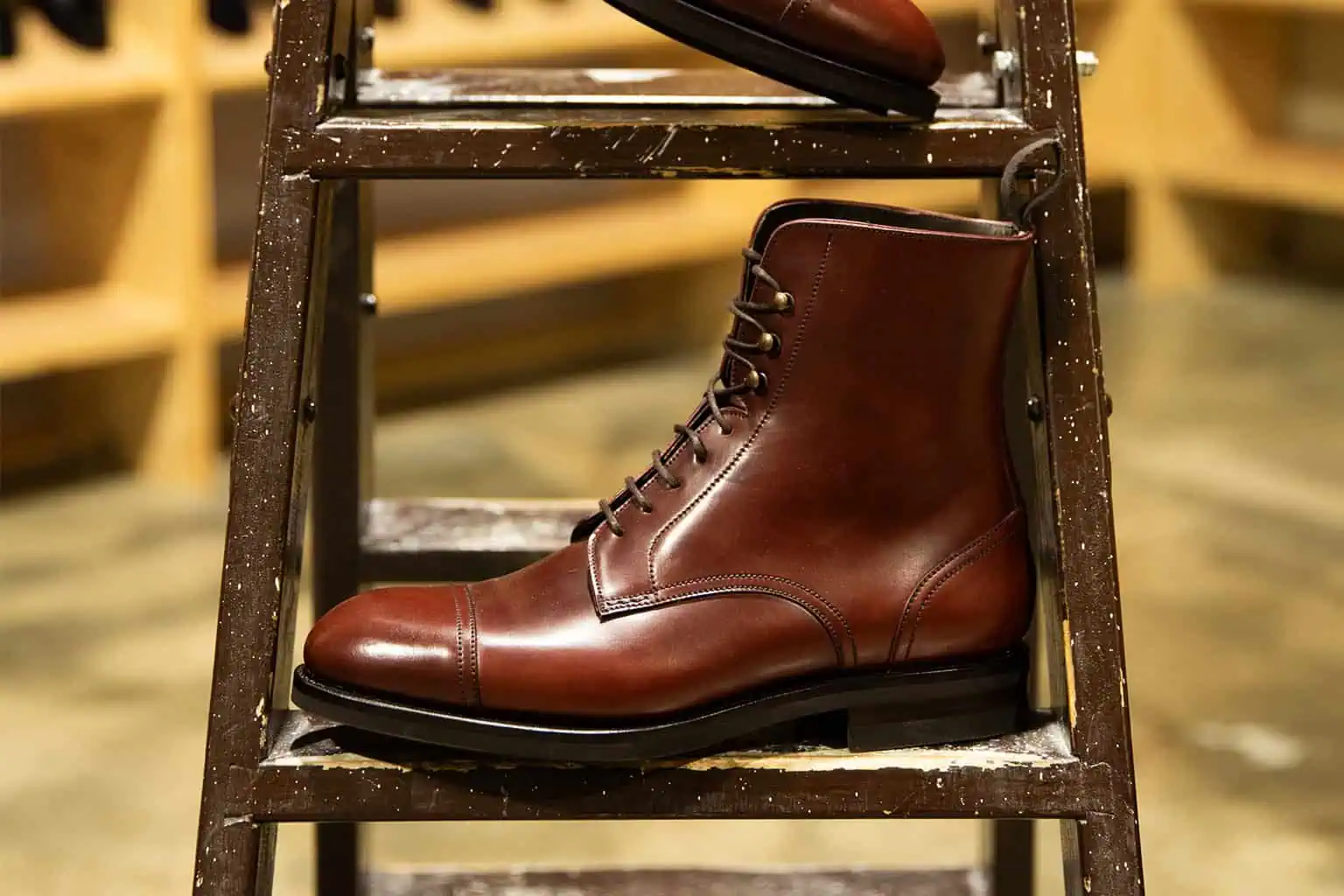 Brown leather cap-toe lace-up boots by Carmina Shoemaker