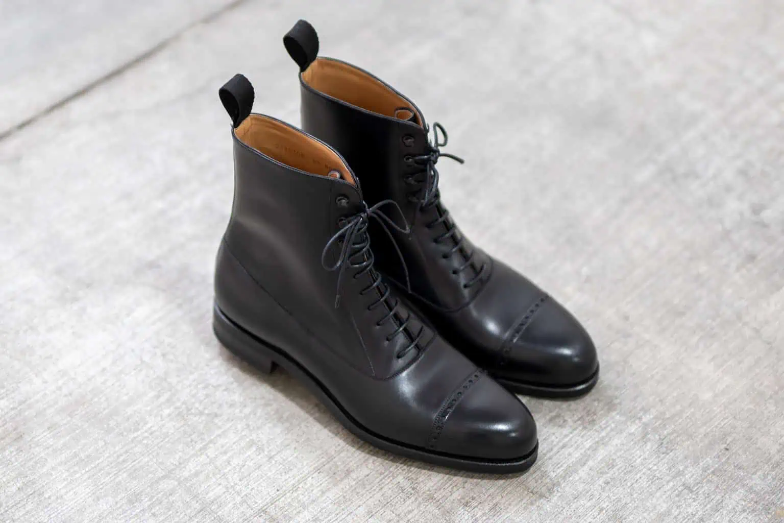 Black lace-up boots by Carmina Shoemaker
